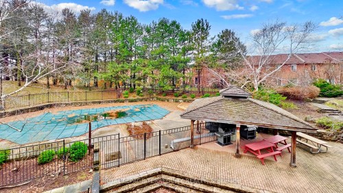 211-20 Cherrytree Drive, Brampton, ON - Outdoor With In Ground Pool