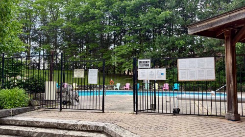 211-20 Cherrytree Drive, Brampton, ON - Outdoor With In Ground Pool