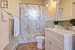 Updated four piece bath with heated floors - 