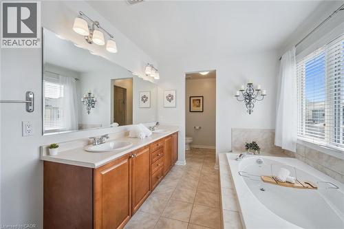 Primary Bathroom with double sinks, 6ft soaker tub, shower area and toilet - 79 Zieman Crescent, Cambridge, ON 