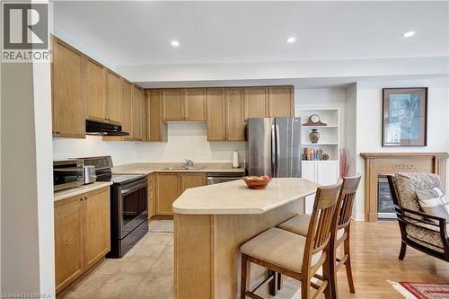 Kitchen featuring wood-finish cabinetry - 120 Beddoe Drive Unit# 6, Hamilton, ON 