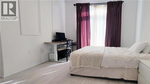 Bright interior space featuring light wood-finish flooring - 142 Foamflower Place Unit# 12, Waterloo, ON - Indoor Photo Showing Bedroom