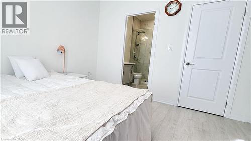 Bedroom featuring light wood-finish flooring and white walls - 142 Foamflower Place Unit# 12, Waterloo, ON - Indoor Photo Showing Bedroom