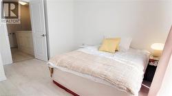 Light wood-finish flooring complements the neutral wall color - 