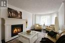 Gas Fireplace In Main Living Room - 2 Birchmount Circle, Wasaga Beach, ON 