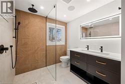 Contemporary bathroom featuring a walk-in shower with patterned wood-finish wall tile and matte black fixtures - 