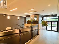 Entrance foyer with tile flooring and a dark accent wall - 