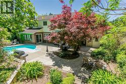 Large yard with mature trees, deck, patio and play areas - 