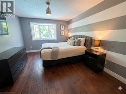 Bright Primary Bedroom with views to backyard - 