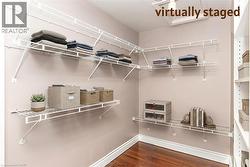 Walk-in closet with access to large storage room or den - 