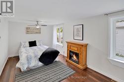 Primary Bedroom w electric fireplace & 2 closets - 