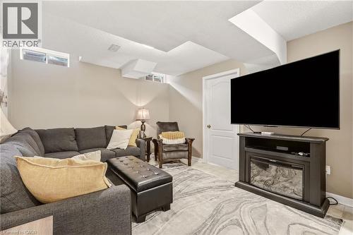 Recreation room featuring recessed lighting, light-toned walls, and a ceiling with structural beams - 2089 Broadleaf Crescent, Burlington, ON 