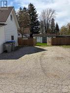 Driveway gated entry to the large fenced, yard - 