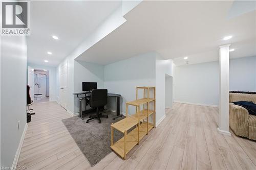 Bright interior space featuring light wood-finish flooring, recessed lighting, and a neutral color palette - 104 Sonoma Valley Crescent, Hamilton, ON - Indoor
