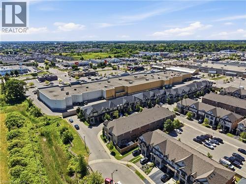 Aerial perspective showcasing a residential community with townhomes and detached properties - 104 Sonoma Valley Crescent, Hamilton, ON - Outdoor With View