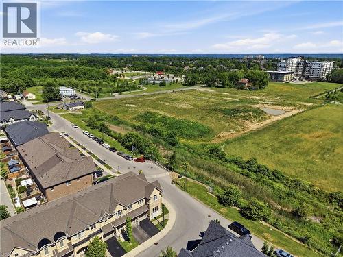 Expansive green space featuring natural terrain and distant structures - 104 Sonoma Valley Crescent, Hamilton, ON - Outdoor With View