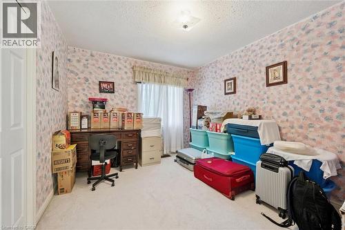 Bedroom featuring a neutral carpet, patterned wallpaper, and a window with blinds and a valance - 176 Sandford Fleming Drive, Waterloo, ON - Indoor