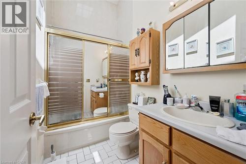 Bathroom with a bathtub and sliding glass shower doors - 176 Sandford Fleming Drive, Waterloo, ON - Indoor Photo Showing Bathroom