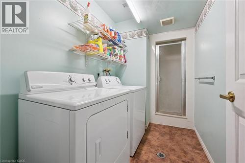 Utility room featuring a built-in shower, wire shelving, and durable flooring - 176 Sandford Fleming Drive, Waterloo, ON - Indoor Photo Showing Laundry Room