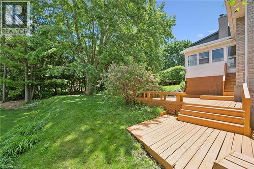 Multi-level wood deck featuring broad stairs and a perimeter railing - 176 Sandford Fleming Drive, Waterloo, ON - Outdoor
