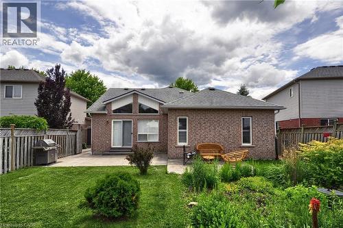 Expansive backyard featuring a manicured lawn and mature landscaping - 95 Drinkwater Drive, Cambridge, ON - Outdoor