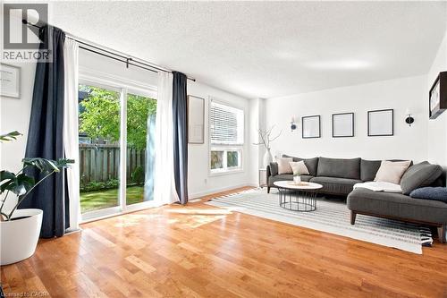 Hardwood-style flooring throughout the main living area - 175 Siebert Avenue Unit# 9, Kitchener, ON 
