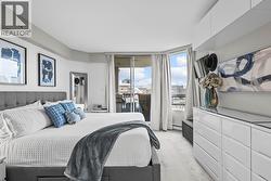 Primary Bedroom with patio access and built-in cabinetry - 