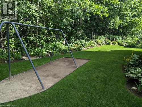 Green backyard with forest background - 561 Marl Meadow Crescent Unit# Lower, Kitchener, ON 