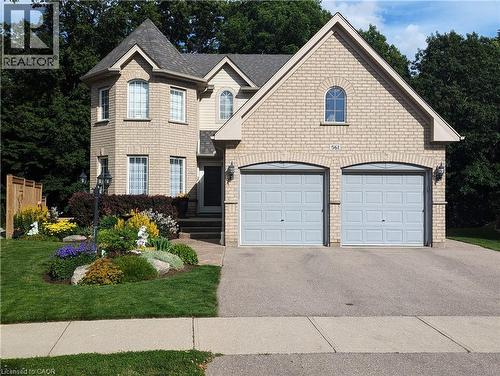 Front view of the house with tenant parking at left side of driveway - 561 Marl Meadow Crescent Unit# Lower, Kitchener, ON 