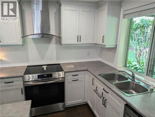 Stainless steel cooktop stove with range hood, double sink - 561 Marl Meadow Crescent Unit# Lower, Kitchener, ON 