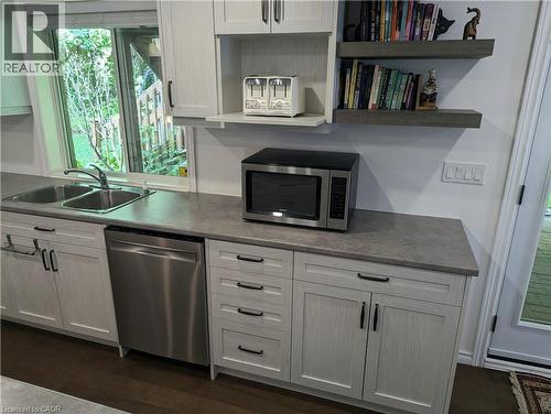 Large window for light, stainless steel dishwasher, microwave, and lots of drawers & cupboards for storage - 561 Marl Meadow Crescent Unit# Lower, Kitchener, ON 