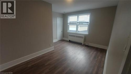 Bedroom with closet and large window - 181 King Street E Unit# 9, Kitchener, ON 