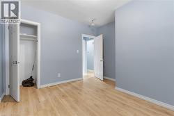 Light wood-finish flooring complements the light blue wall tones - 