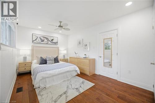 Bedroom featuring rich wood-finish flooring and a neutral color palette - 1376 Royal Drive, Burlington, ON 