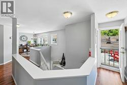 Upper level showing open staircase and access to patio - 