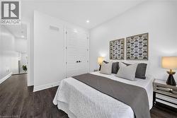 White walls with dark wood-finish flooring - 