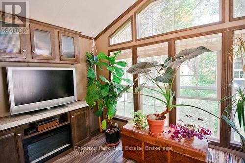 Den with Electric Fireplace - Unit 1 - 98 North Shore Road, Kearney (Proudfoot), ON 