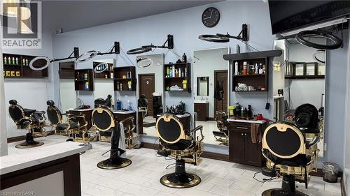 Spacious commercial interior featuring multiple styling stations with black and gold chairs - 9 Beaumaris Drive Unit# B4, Brampton, ON 