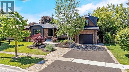 Brick and siding exterior featuring a multi-level design - 23 Mackenzie Drive, Georgetown, ON 