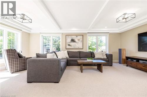 Recessed lighting illuminates the tray ceiling with exposed beams - 23 Mackenzie Drive, Georgetown, ON 