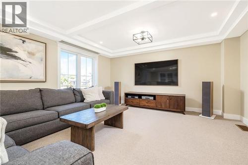 Living space featuring recessed lighting, a coffered ceiling, and a light-colored carpet - 23 Mackenzie Drive, Georgetown, ON 