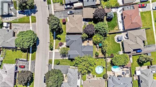 Aerial perspective showcasing residential properties with established trees and green spaces - 23 Mackenzie Drive, Georgetown, ON 