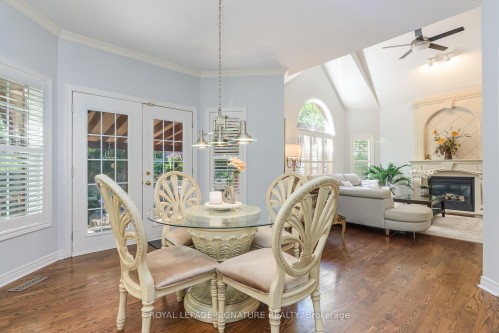 27 Autumn Ridge Trail, Kitchener, ON - Indoor Photo Showing Dining Room With Fireplace