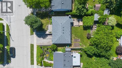 Aerial depiction of a property with a grey shingle roof, a paved driveway, and a verdant backyard - 14 Gateway Drive, Guelph, ON 