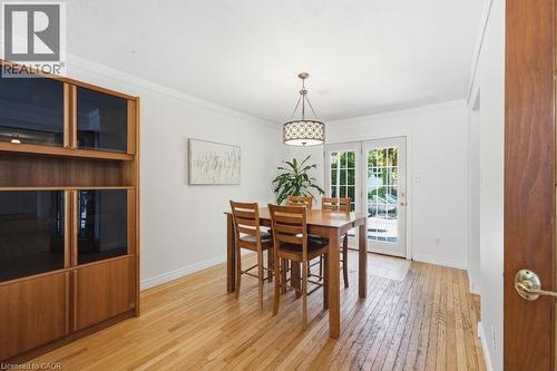 Dining area featuring wood-finish flooring and white walls - 14 Gateway Drive, Guelph, ON 
