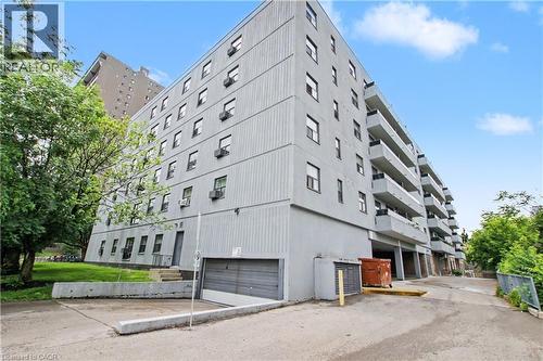 Multi-story residential building featuring a light gray exterior - 175 Hunter Street E Unit# 401, Hamilton, ON - Outdoor