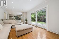 Hardwood flooring throughout, recessed ceiling lighting, and crown molding - 