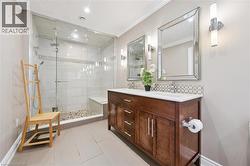 Dual vanity with wood-finish cabinetry and white countertops - 
