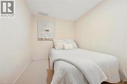 Neutral-toned walls complement the light-colored carpet flooring - 