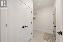 door to garage, storage and laundry area - 